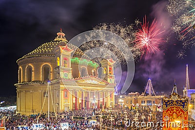 MOSTA, MALTA - 15 AUG. 2016: Fireworks at the Mosta festival at night with the famous Mosta Dome Editorial Stock Photo